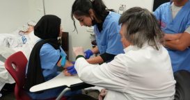 student and doctor performing medical procedure