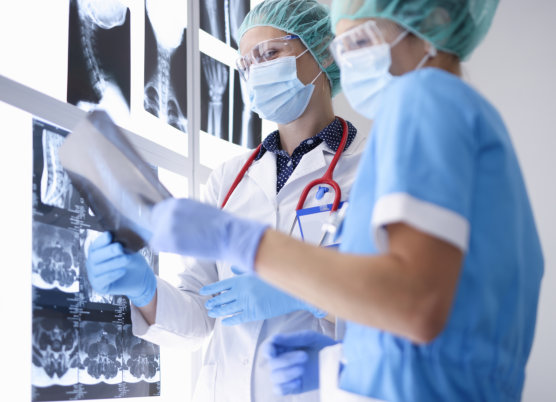 two medical staff checking the results