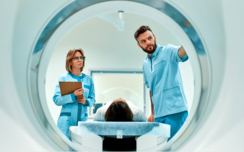 Patient lying on bed, ready for MRI scan in hospital setting